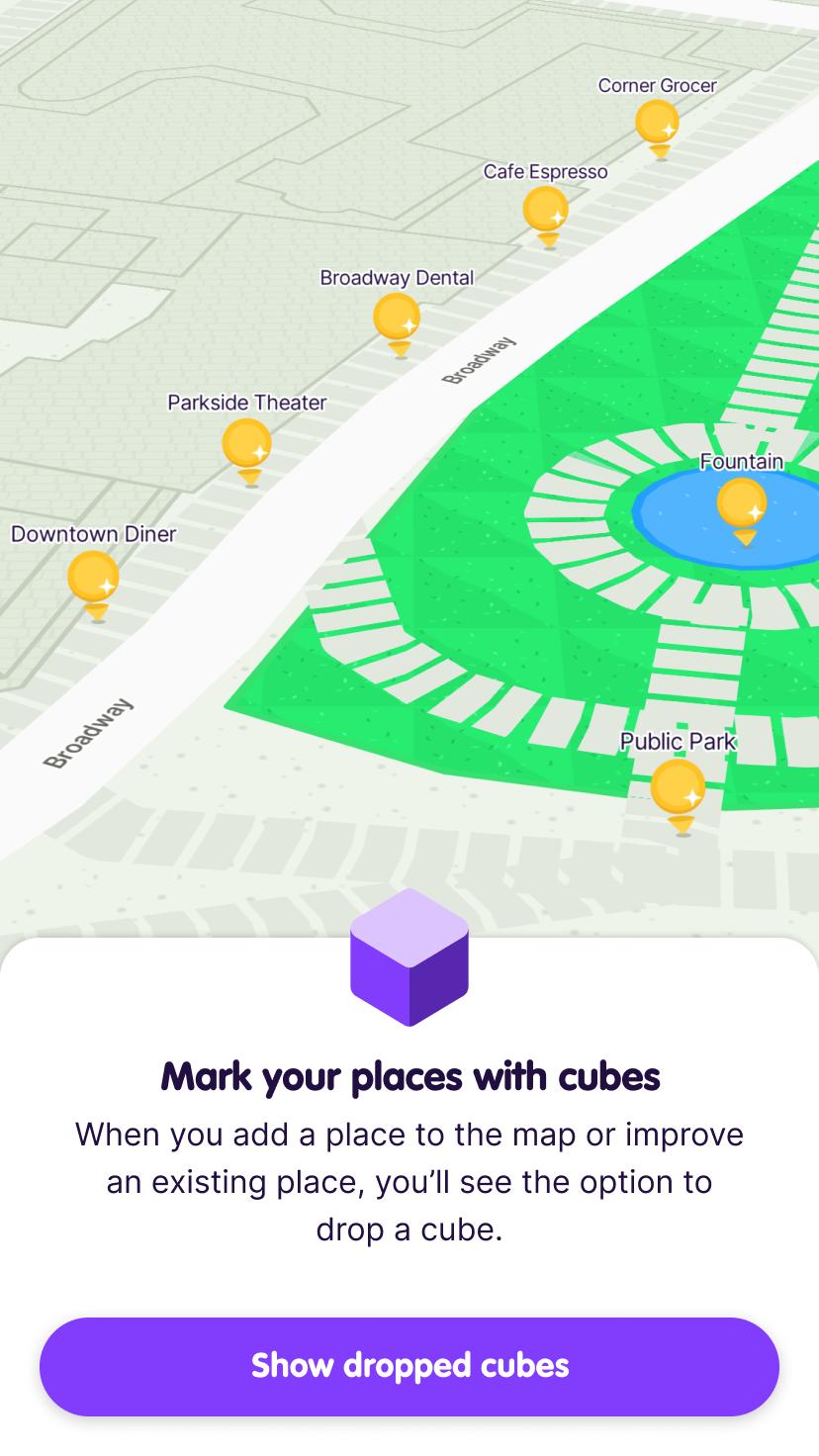 Screenshot from the app intro showing nearby places available for points on the map and prompting the user to tap a button to Show dropped cubes.
